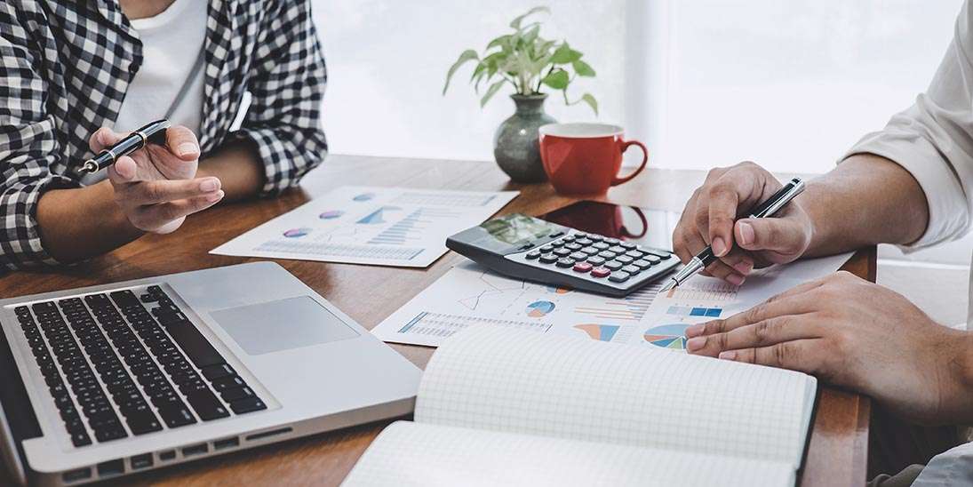 sales representative with mobile device meeting customer